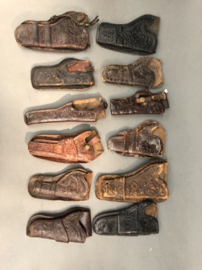 12 embossed pattern open top revolver leather holsters.
