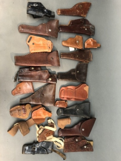 21 pistol and revolver leather holsters.