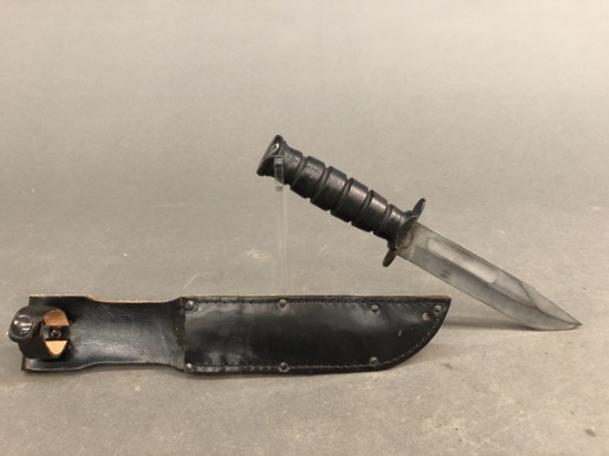 U.S. Camillus fighting knife with leather sheath.