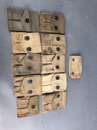 11 U.S. WW1 and WW2 magazine pouches and First Aid Kit pouch.