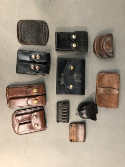 6 Leather magazine holsters and other accessories.