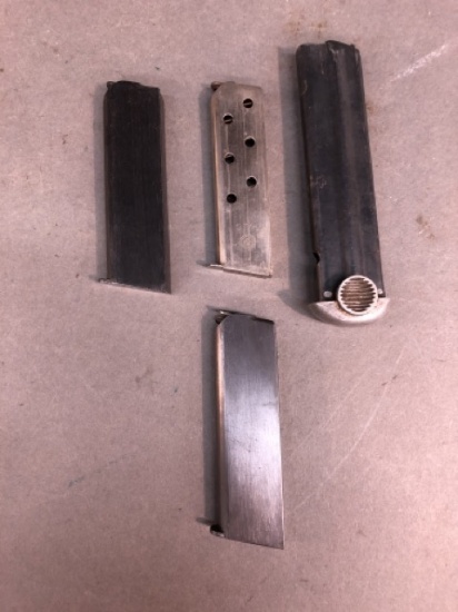 Group of pistol magazines including Nambu