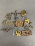 Assorted military buckles and pins.