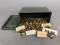 Assorted pistol brass and dummy rounds in ammo can