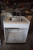 single bay sink with wood cabinet