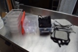 lot of plasticware, plastic insert pans, oven pads