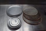 lot of pizza serving trays and screens