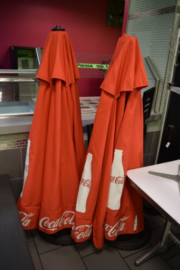 lot of 2 Coke shade umbrellas with bases and bluetooth