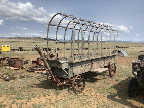 Horse-Drawn Covered Wagon on Iron Wheels