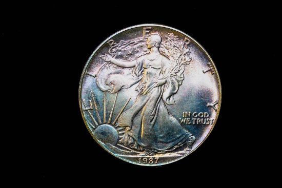 1987 1oz .999 FINE SILVER AMERICAN EAGLE COIN **NICE OBVERSE TONING**