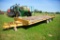 Redi Haul 20 ton flatbed equipment trailer, dual tandem axles, rear ramps (