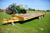 Redi Haul 20 ton flatbed equipment trailer, dual tandem axles, rear ramps (