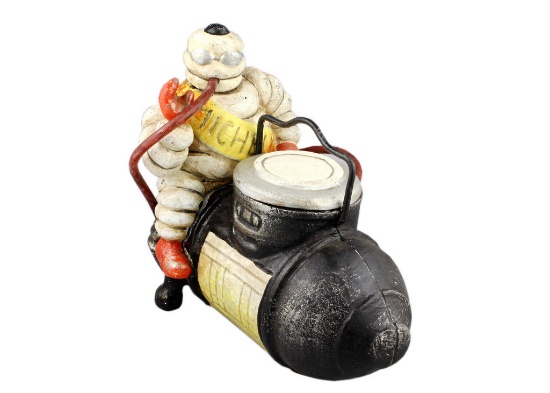 Michelin Man on Compressor'. Cast Iron Figure.