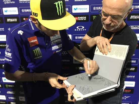 The first of two specially signed Moto GP hardback books