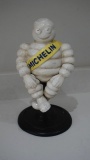 'Michelin Man on stool' figure.