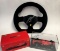 Racing steering wheel, signed by Kimi Raikkonen