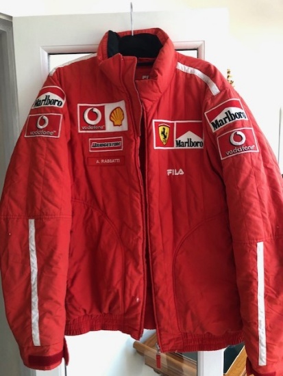 A set of Ferrari F430 car covers, pit crew jacket and other items