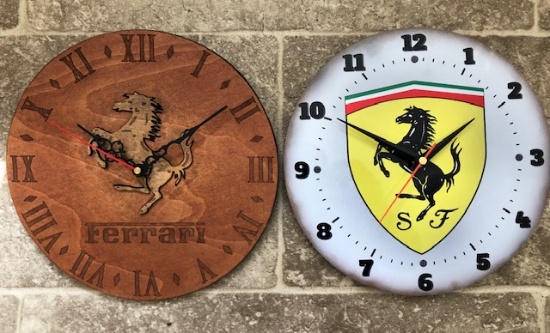 Two Ferrari themed wall clocks