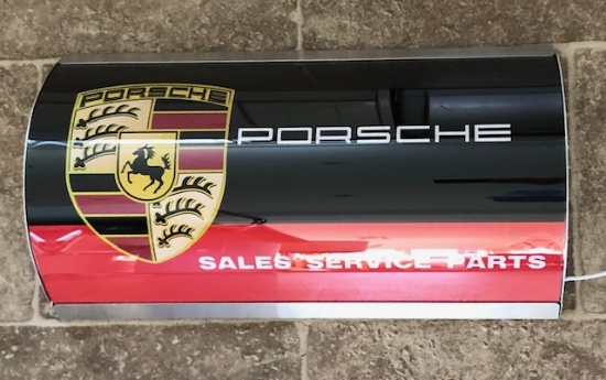 Illuminated wall sign with Porsche logo