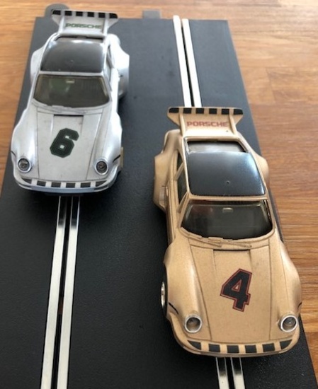 A pair of iconic 1970s Porsche 935 Scalextric cars