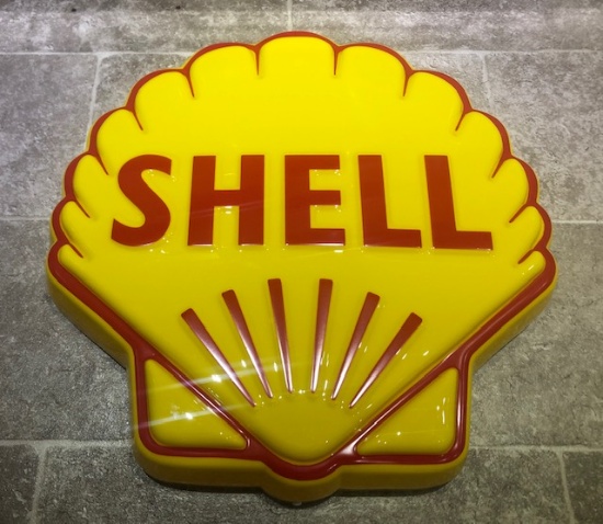 An illuminated Shell Oil wall sign