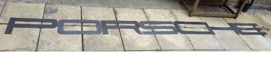 A very large font-correct Porsche hanging wall sign