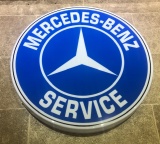 A large circular Mercedes-Benz service illuminated wall sign