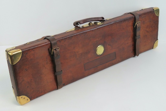 A good vintage leather 12 gauge shotgun case