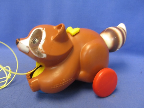 1979 Fisher Price/Quaker Oats Plastic Raccoon Pull Toy  with rolling plastic Ball & spring held tail