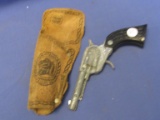 Vintage Toy Cowboy Cap Pistol in Leather Holster (cap gun has Indian Chief Head on the grips)