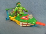 Teenage Mutant Ninja Turtles Figurine and Attack Speed Boat – Marked 1991 Mirage Studios