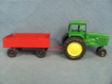 Die-Cast Green Ertl Tractor & Red Metal Pull Behind Wagon – Together 11” long, 3 ¾” tall, 3 ½” wide