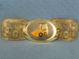Three Belt Buckles – One with Skid-Steer Loader and Two Featuring Large John Deere Tractors