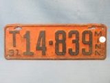 1931 Minnesota License Plate – Black lettering on Orange background - “T14839” - 12 3/4”L x 4 1/2”T