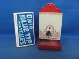Metal Match Stick Holder – Lady Standing By Fence With Flowers – Ohio Blue Tip Match Box