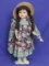 Porcelain Doll with Stand – Dark Braids – Blue eyes – 17” tall