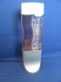 Twin Lava Lamp –2  Wavy Glass Bottles Contain  Glitter & a Purplish “Wax” Assembled 16” T x 5” W X 3