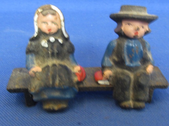 Painted Cast Iron Amish Boy & Girl Sitting on a Bench (3 pieces) 3” Tall Figures on a 3” L Bench