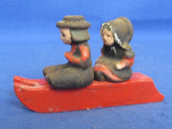 Painted Cast Iron Amish Boy & Girl Sitting on a Sled -2” Figures on 3” L Sled Appx