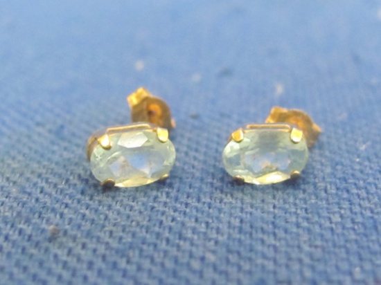 Pair of 10 Kt Gold Earrings with Blue Topaz – Total weight is 0.5 grams – Stones are 6mm long