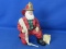 “Fabriche KSA Collectibles” - 10” Tall Santa Dressed as Fireman w/ Real Cloth Hose -