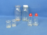 Lot of 4 Small Glass Jars – 2 Salt and Pepper Shakers with Red Plastic Caps -