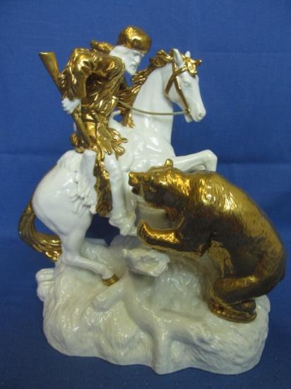White & Gilded Ceramic Sculpture of a Frontiersman on Horseback  & Grizzly Bear