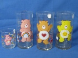 4 Care Bears Glasses – 3 are the Pizza Hut 1983 Collector Glasses & 1 is a votive Holder