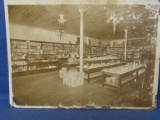 Sepia Tone Photo of Early 1900's Store Interior – Products from Cigars to China, Cookies to an elect