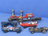 Box of 7 Pinewood Derby Cars (Scouting) and 2 plastic Pinewood Derby Trophy Cups