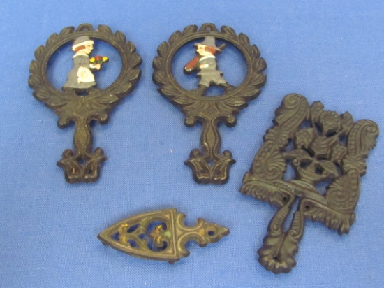 4 Small Cast Iron Trivets – Unmarked – 1 Pair is a Man & Woman – Longest is 5 1/4”