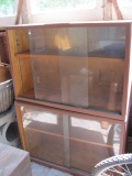 Two Piece Wood Cabinet With Sliding Glass Doors – Total H 48 1/2” T – 12” x 36”