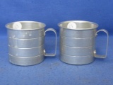 2 Vintage Aluminum Measuring Cups w/ embossed rings ¼, ½, ¾ & 1 Cup – Both are appx  2 1/2” Tall &1