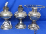 3 Nickel Plated Ray-O Lamp Bases (2 electrified)  1 with a Crushed B&H Burner on top – each appx 12”